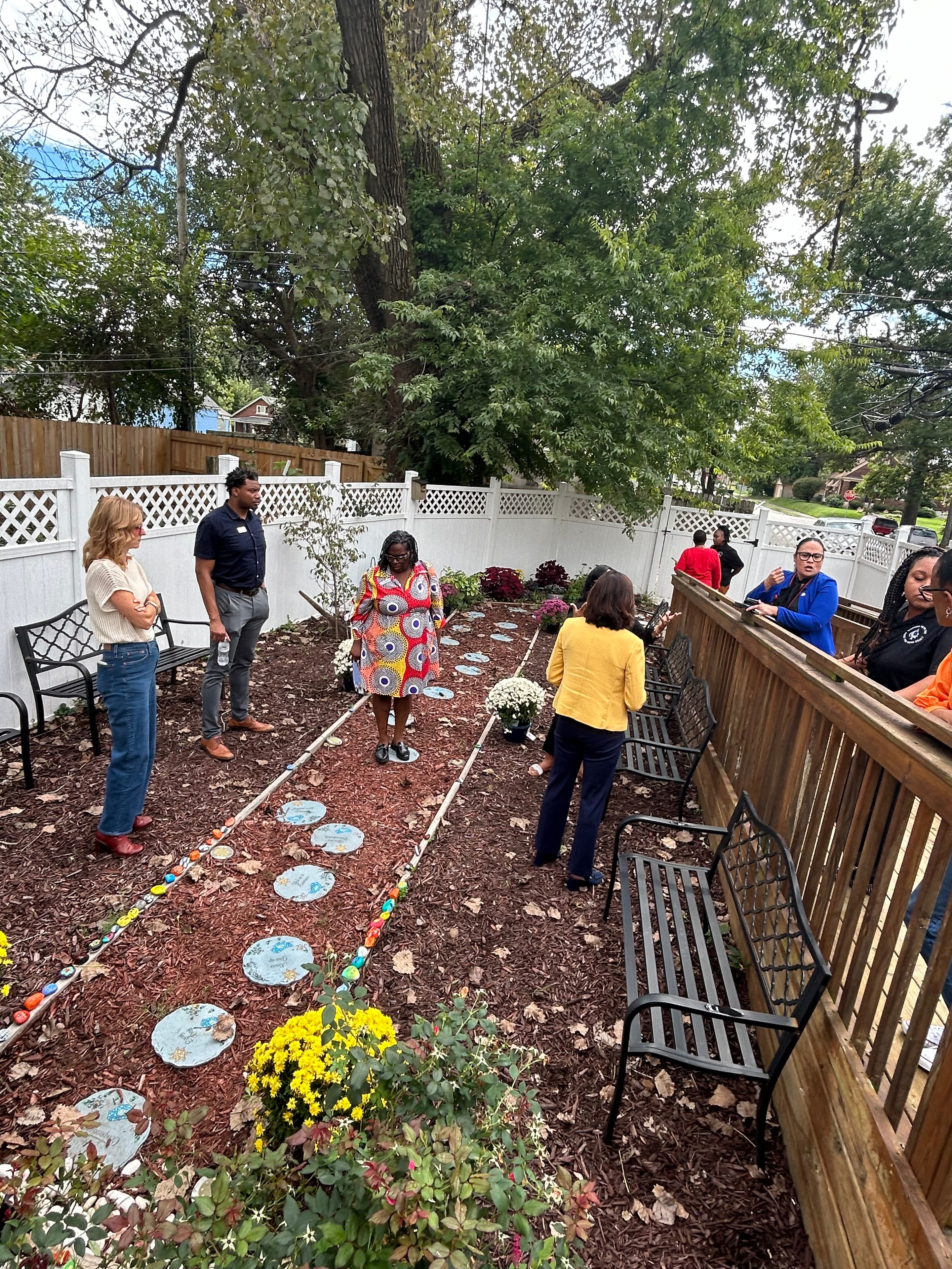 Community members in the healing garden at The ACE Project