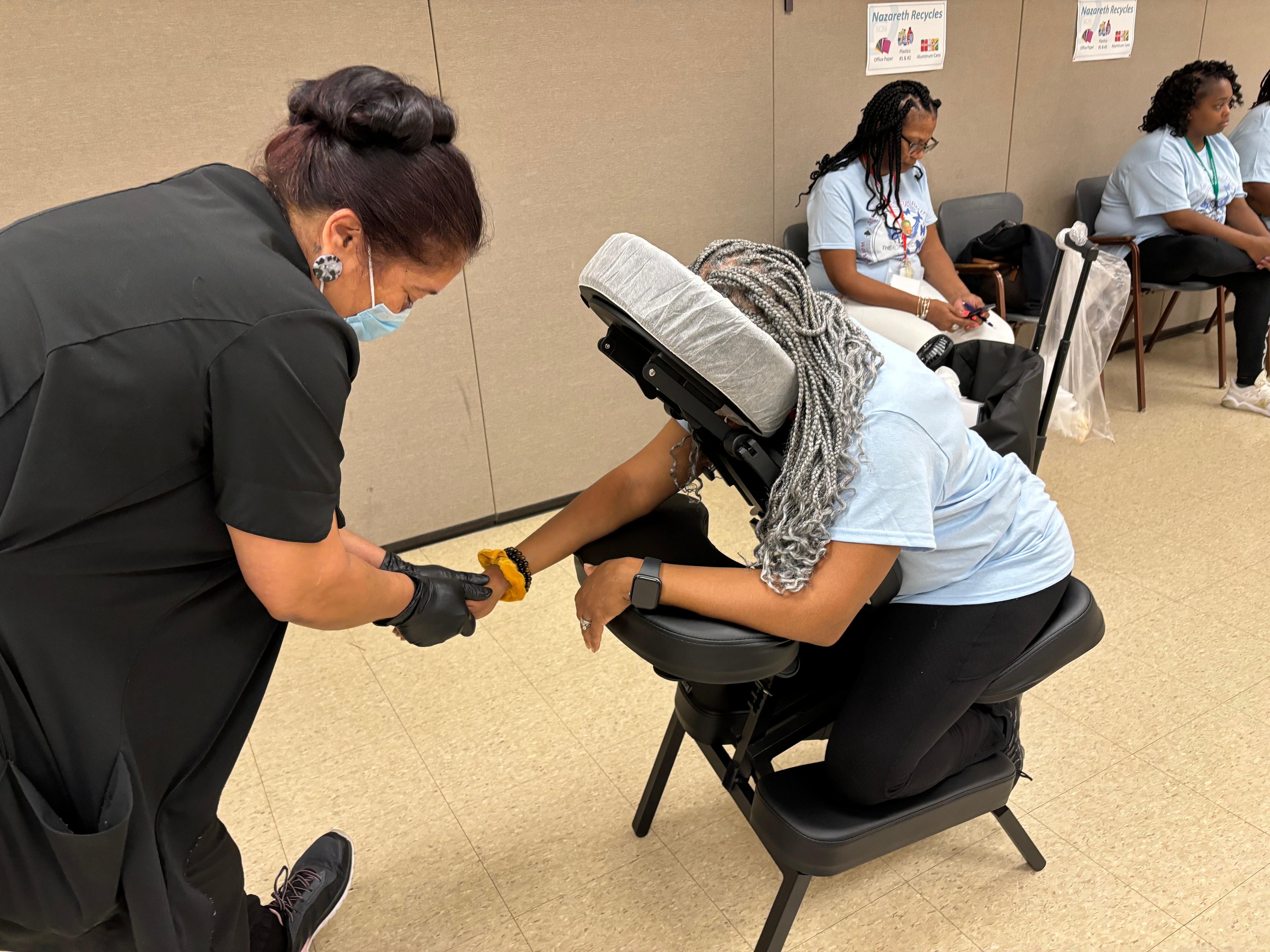 Massage therapy session at ACE Healing Project community wellness event