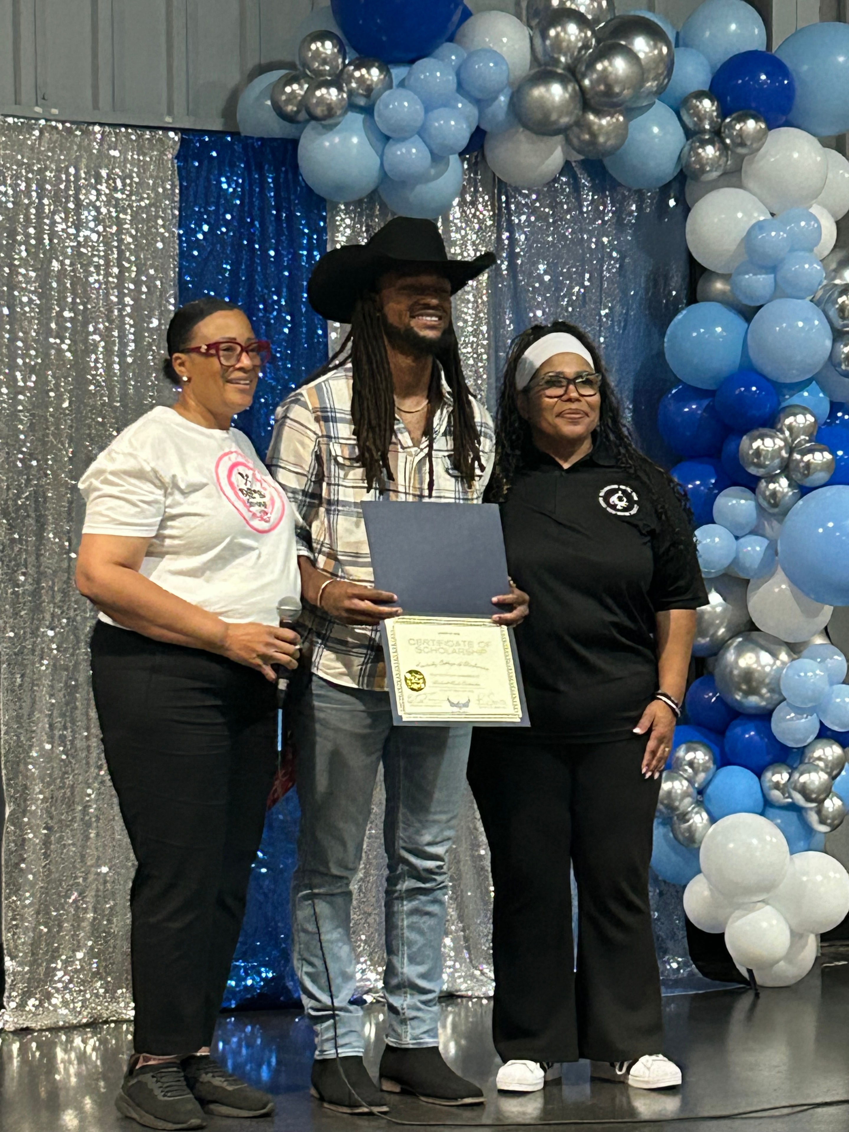 ACE Project graduation ceremony with balloon backdrop
