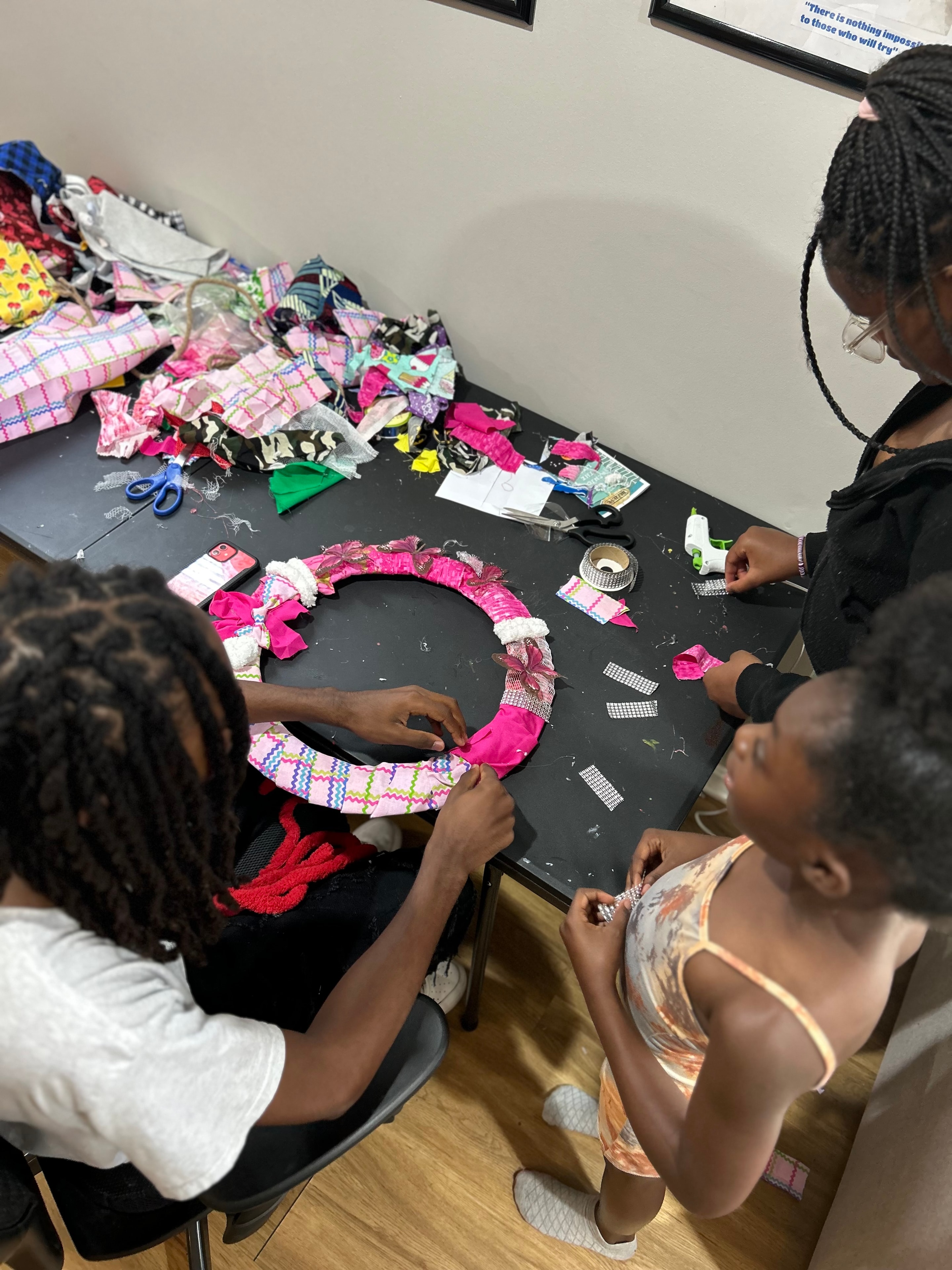 Youth participants making a fabric wreath at ACE Project summer enrichment craft activity