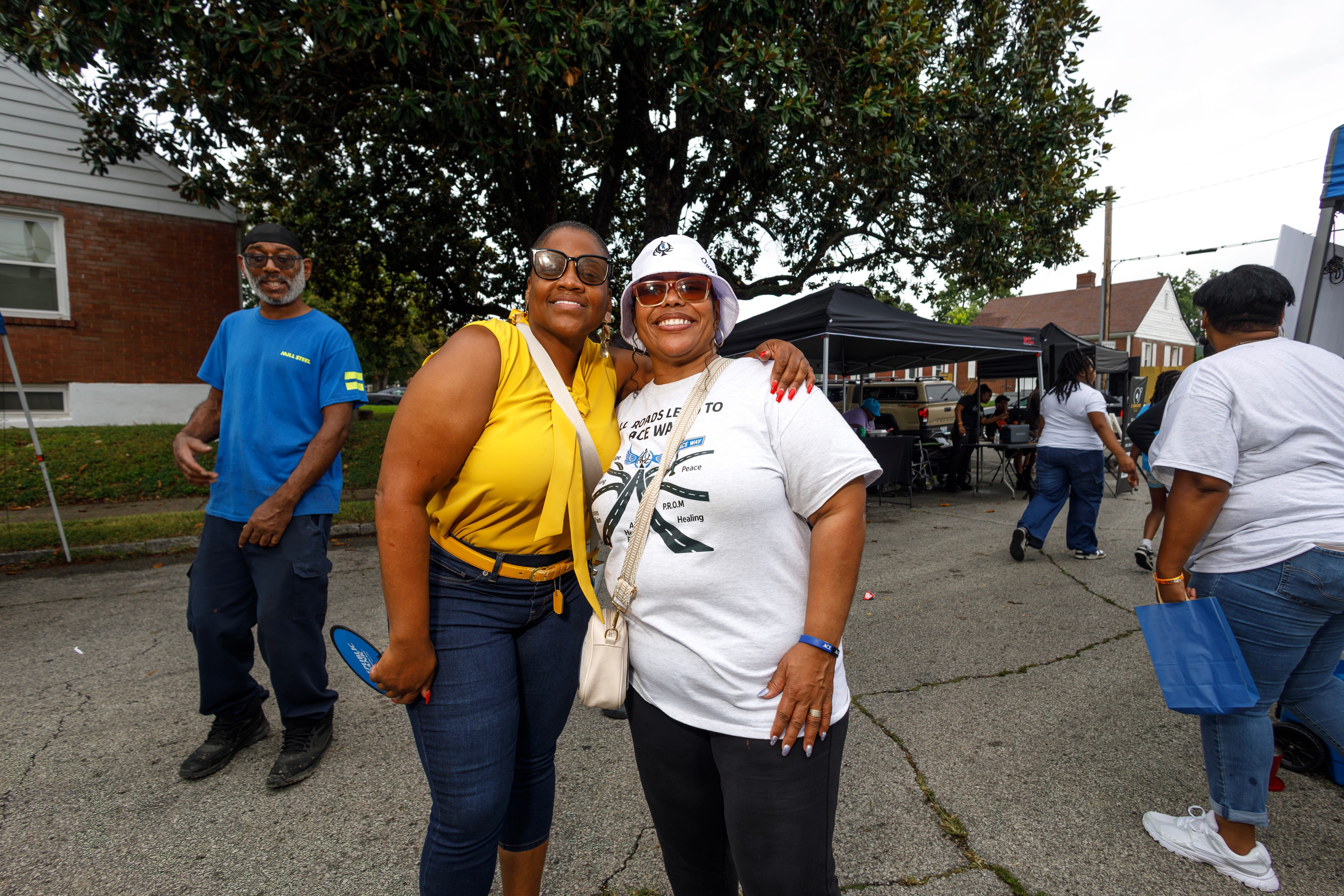 Two community members smiling at ACE Way block party